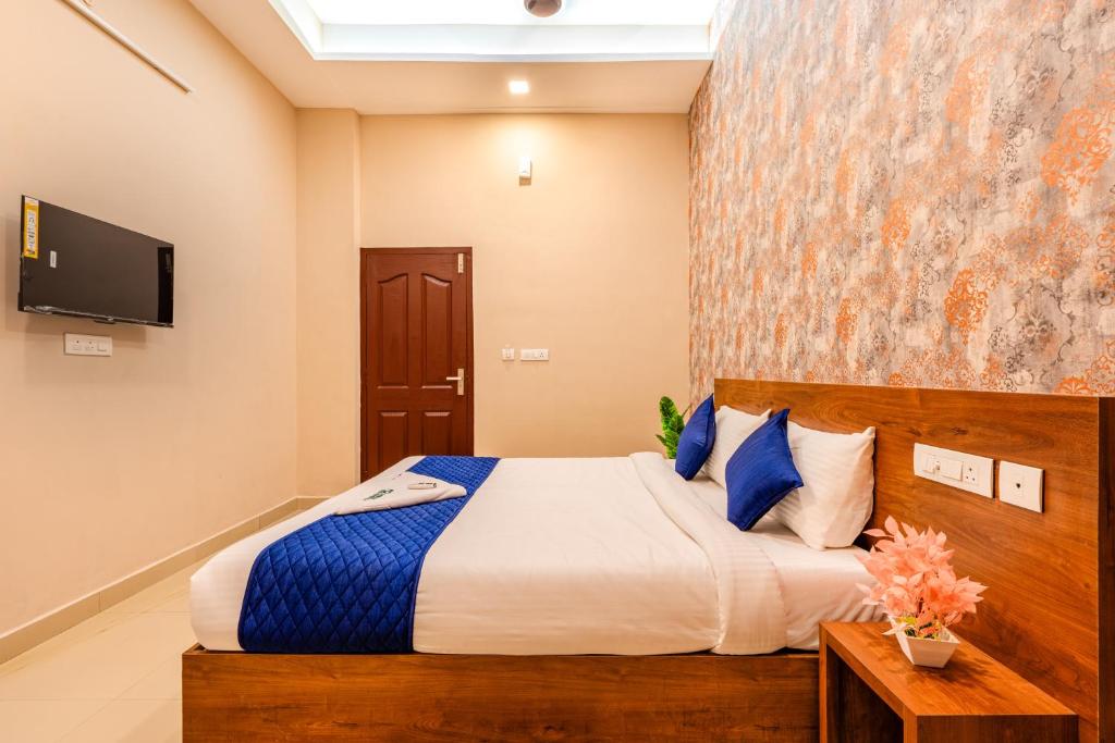 Postel nebo postele na pokoji v ubytování Yaad Residency