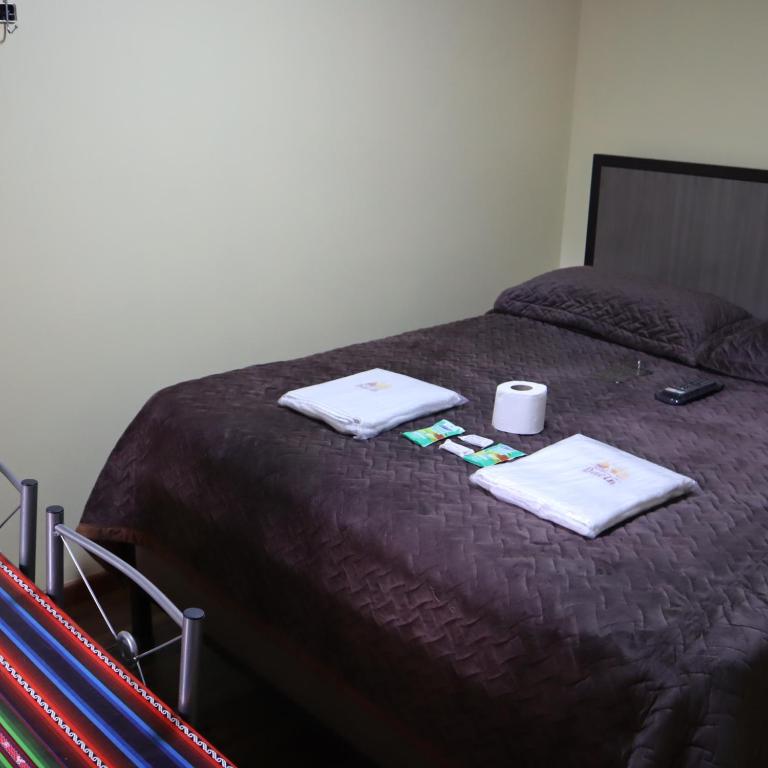 Postel nebo postele na pokoji v ubytování HOTEL DACIN