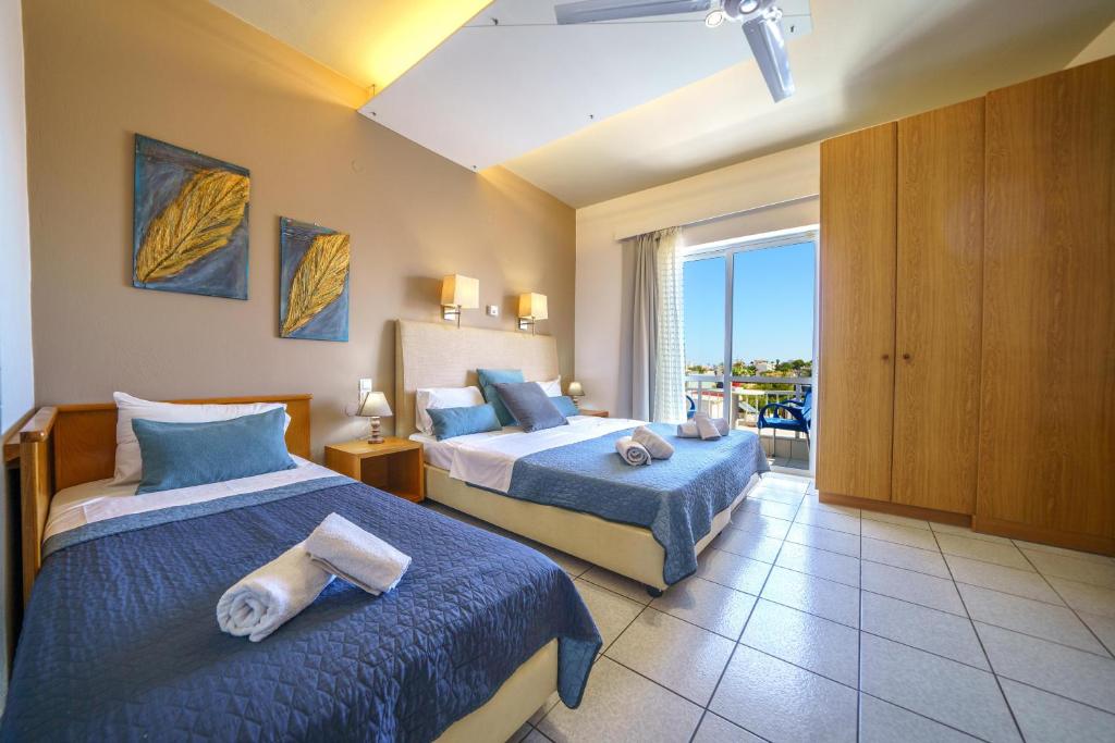Postel nebo postele na pokoji v ubytování RODI BLUE apartments