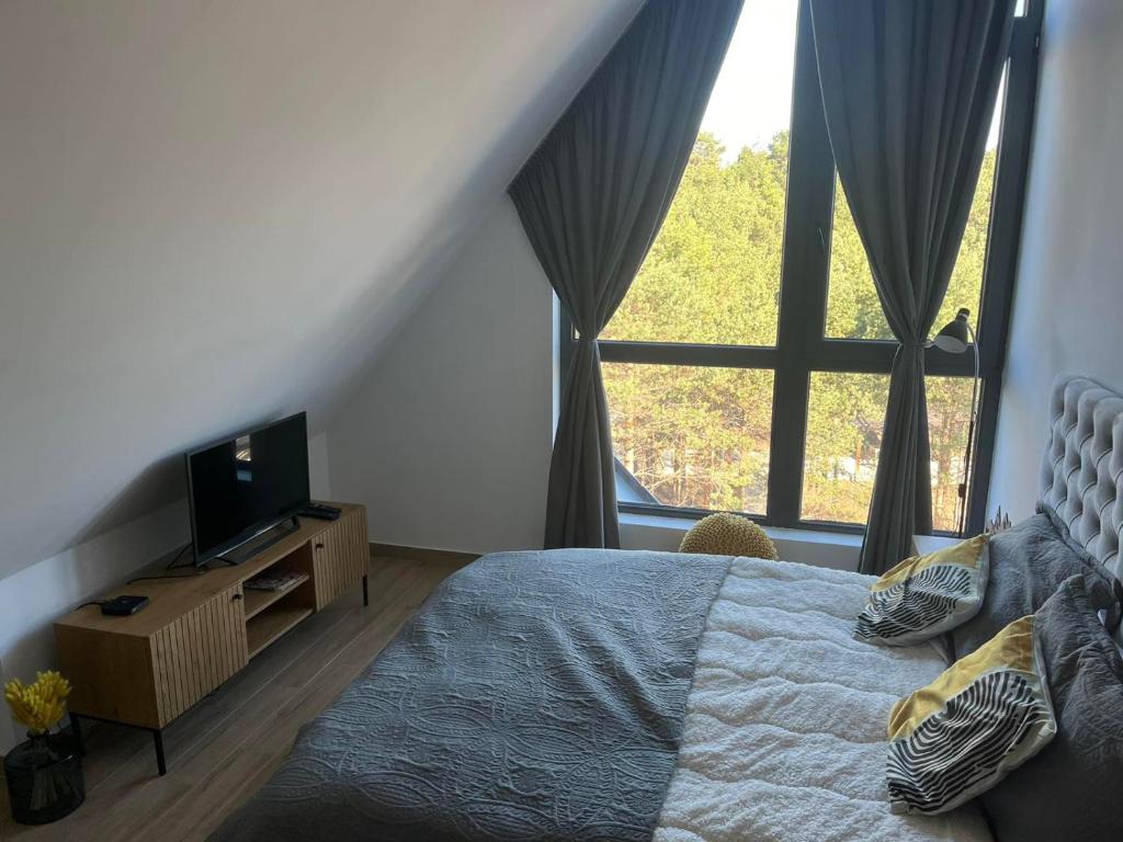 Uma cama ou camas num quarto em Apartman Yellow Moon