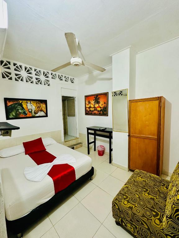 Postel nebo postele na pokoji v ubytování Hostal La Española de Getsemani