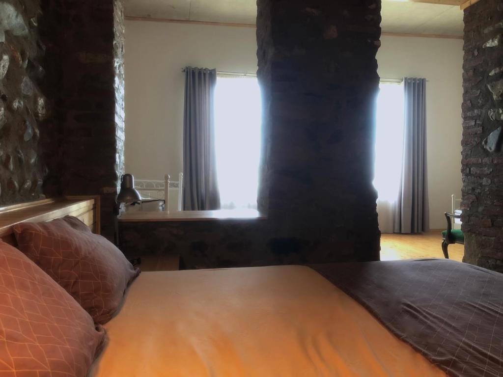 Postel nebo postele na pokoji v ubytování Lokokina Guesthouse