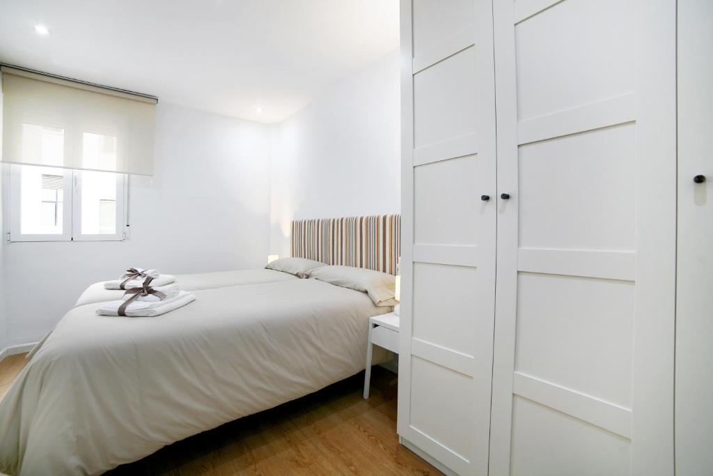 Posteľ alebo postele v izbe v ubytovaní Apartamento La Flamenquita