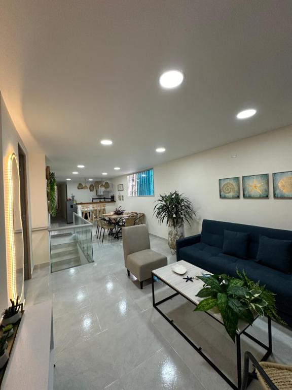 Coin salon dans l'établissement Cabaña salgar - la casa de la playa