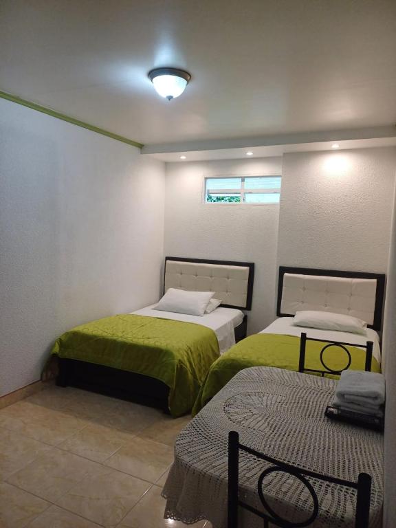 Voodi või voodid majutusasutuse Aparta-Hotel El Dorado toas