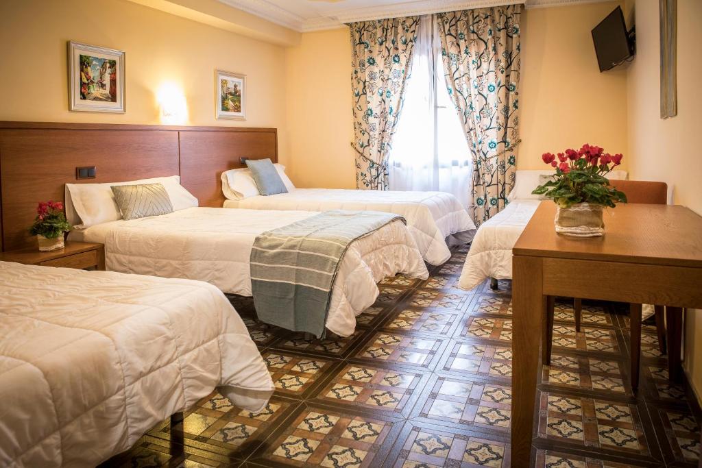 Postel nebo postele na pokoji v ubytování Hotel Casa José Díaz