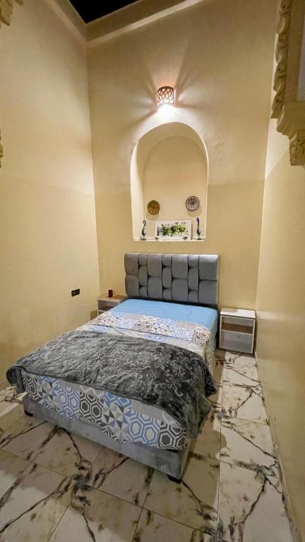 Postel nebo postele na pokoji v ubytování Riad Dar Al Manzah