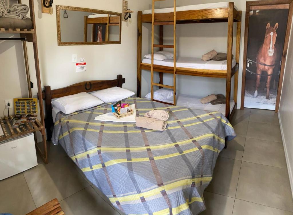 Postel nebo postele na pokoji v ubytování Pousada Vila do Cowboy
