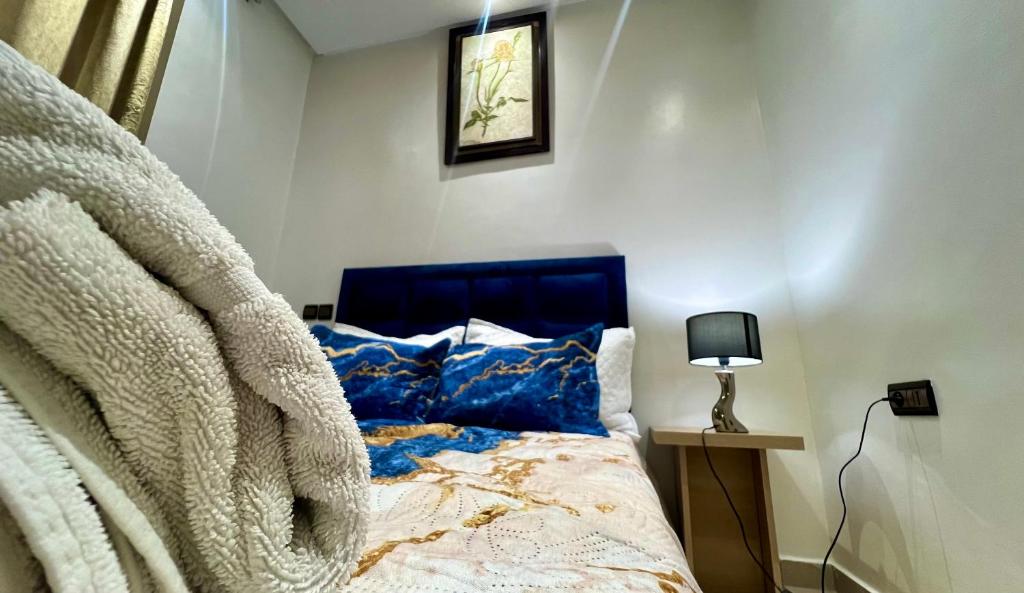 Postel nebo postele na pokoji v ubytování Appart Prestige au Centre de Rabat Luxe & Confort
