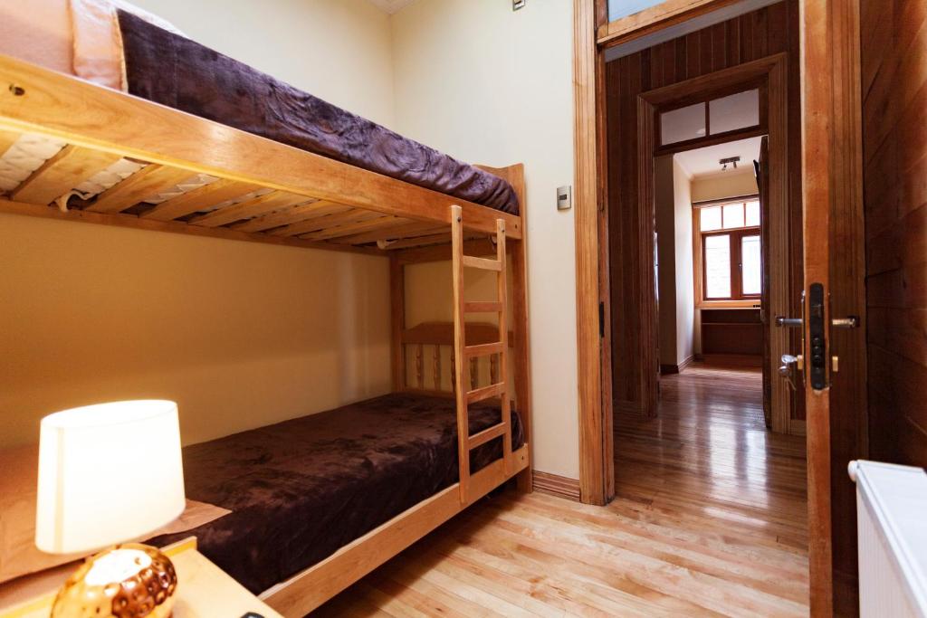 Postel nebo postele na pokoji v ubytování Hostal Boutique Patagonia Mística