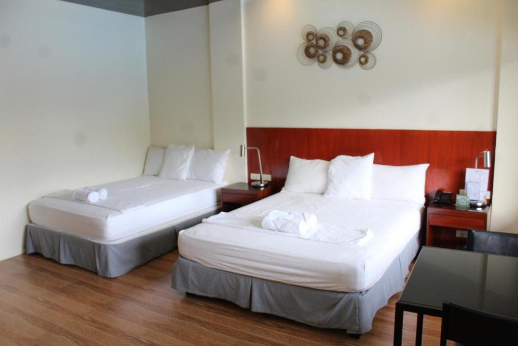 Postel nebo postele na pokoji v ubytování MaClare Resort