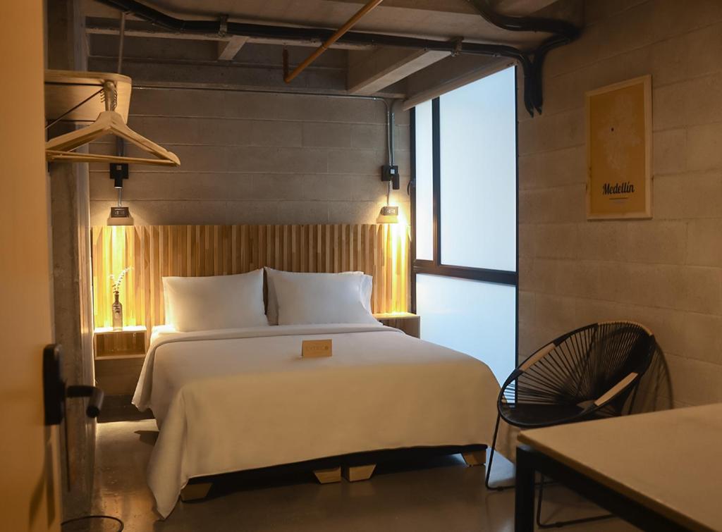 Postel nebo postele na pokoji v ubytování Cytrico Hotel Laureles Estadio