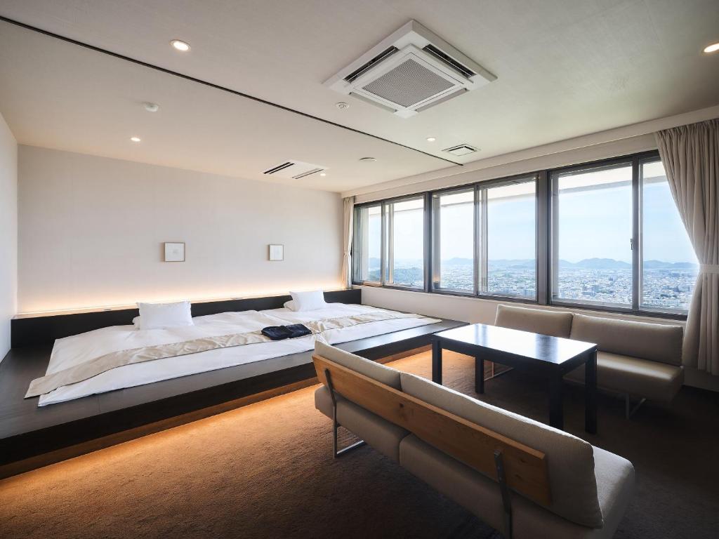 Postel nebo postele na pokoji v ubytování Setre Highland Villa Himeji