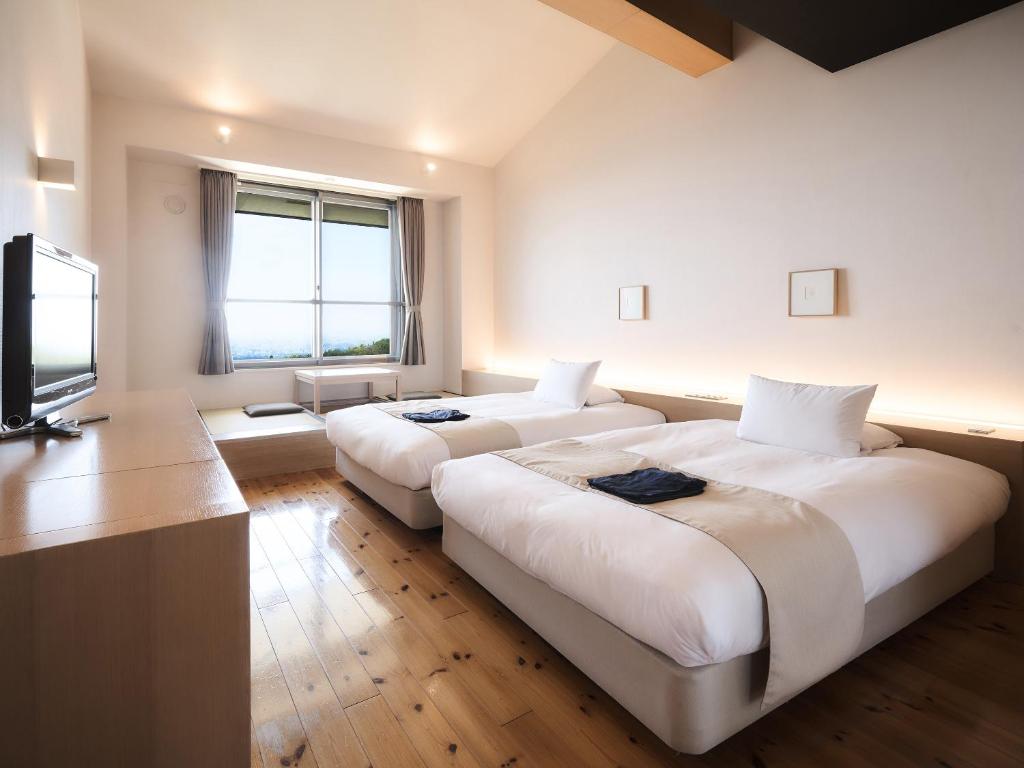 Postel nebo postele na pokoji v ubytování Setre Highland Villa Himeji