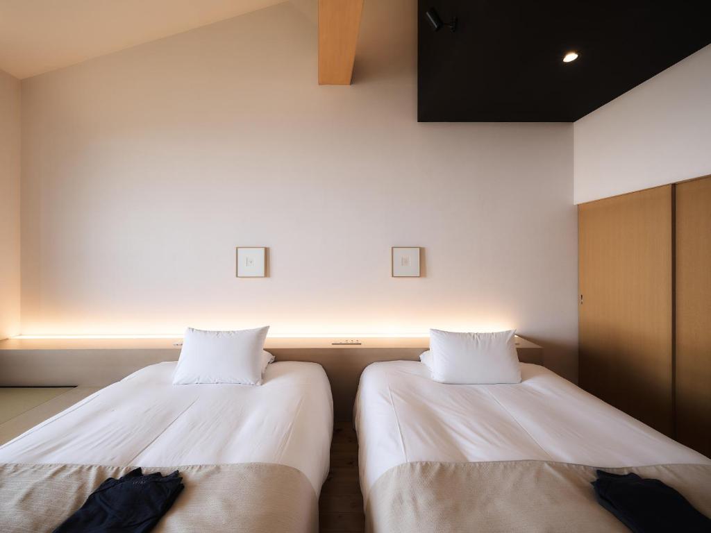 Postel nebo postele na pokoji v ubytování Setre Highland Villa Himeji