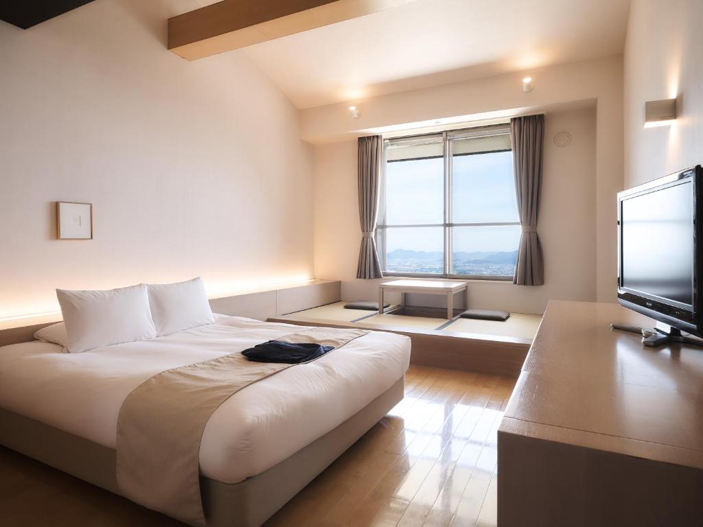 Postel nebo postele na pokoji v ubytování Setre Highland Villa Himeji