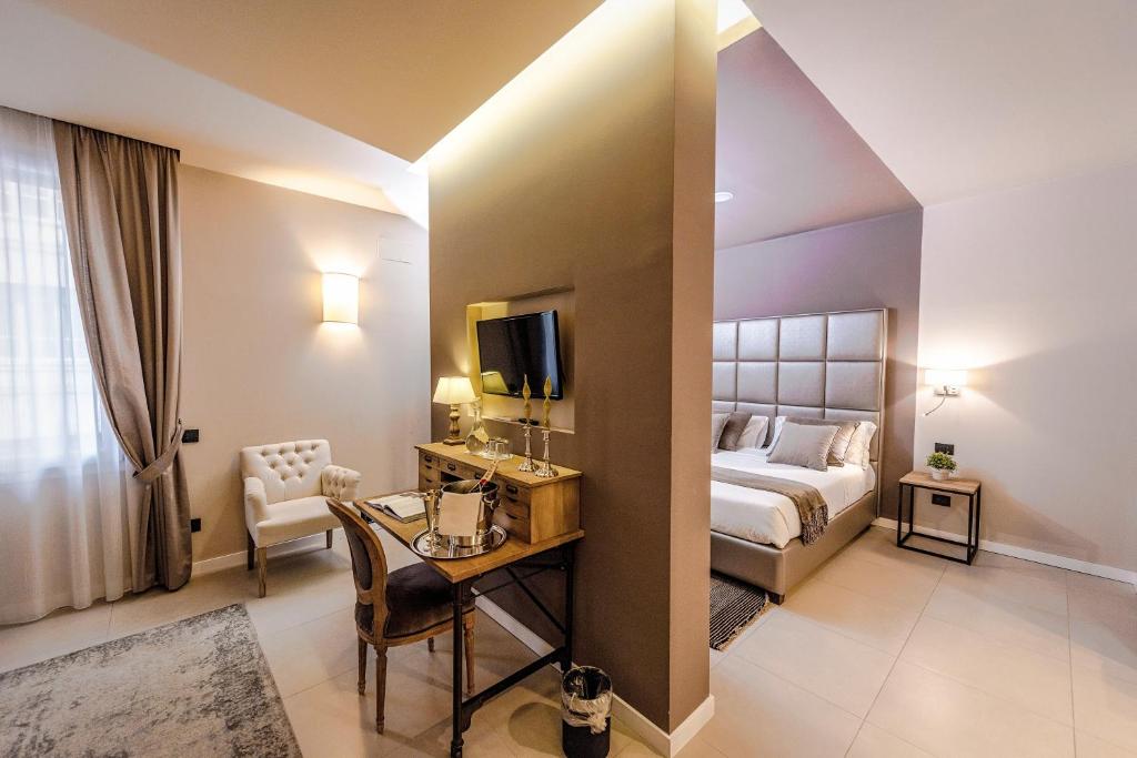 Postel nebo postele na pokoji v ubytování Delle Vittorie Luxury Rooms&Suites