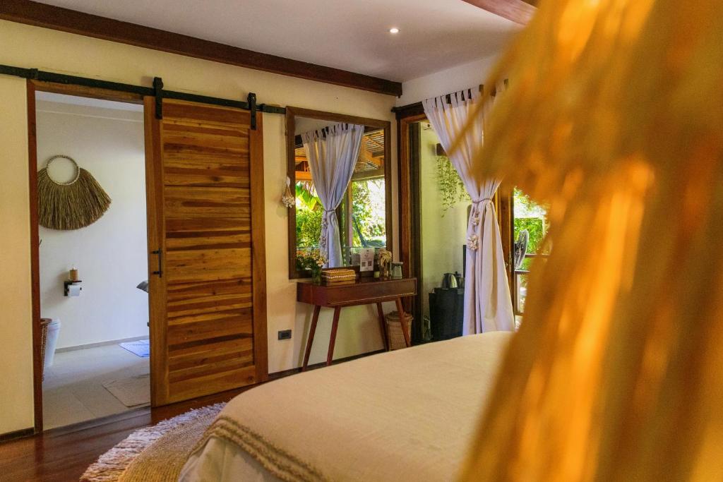 Postel nebo postele na pokoji v ubytování Mantaray Siargao