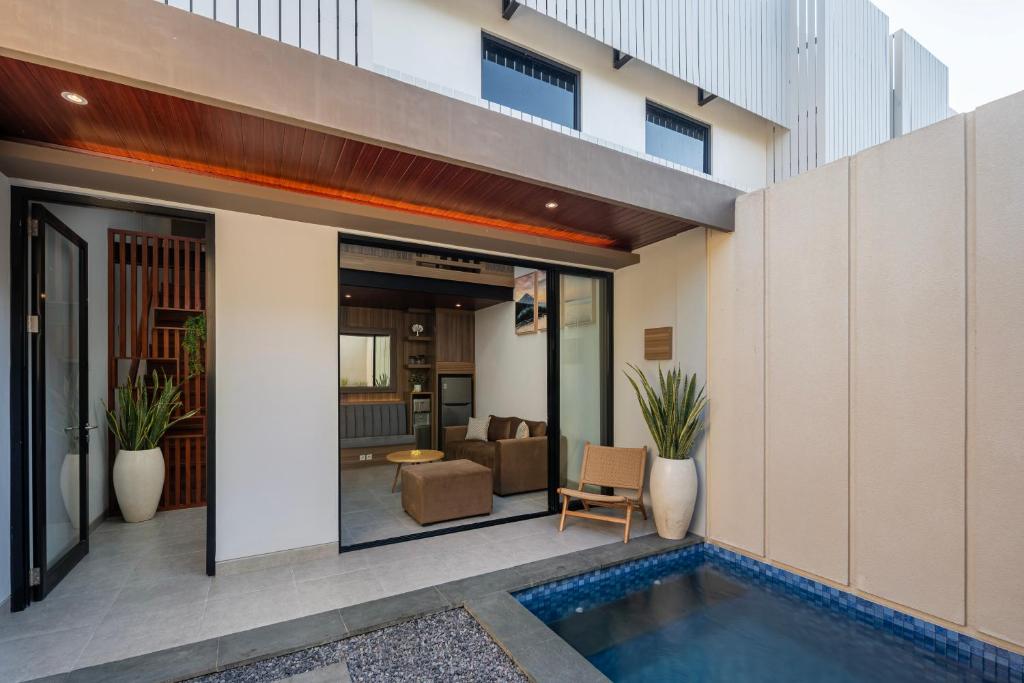 an image of a house with a swimming pool at The New Moon Umalas in Seminyak