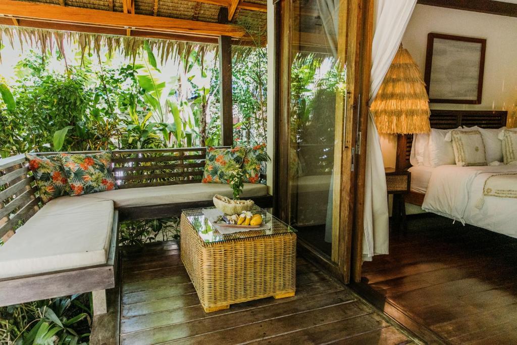 Postel nebo postele na pokoji v ubytování Mantaray Siargao