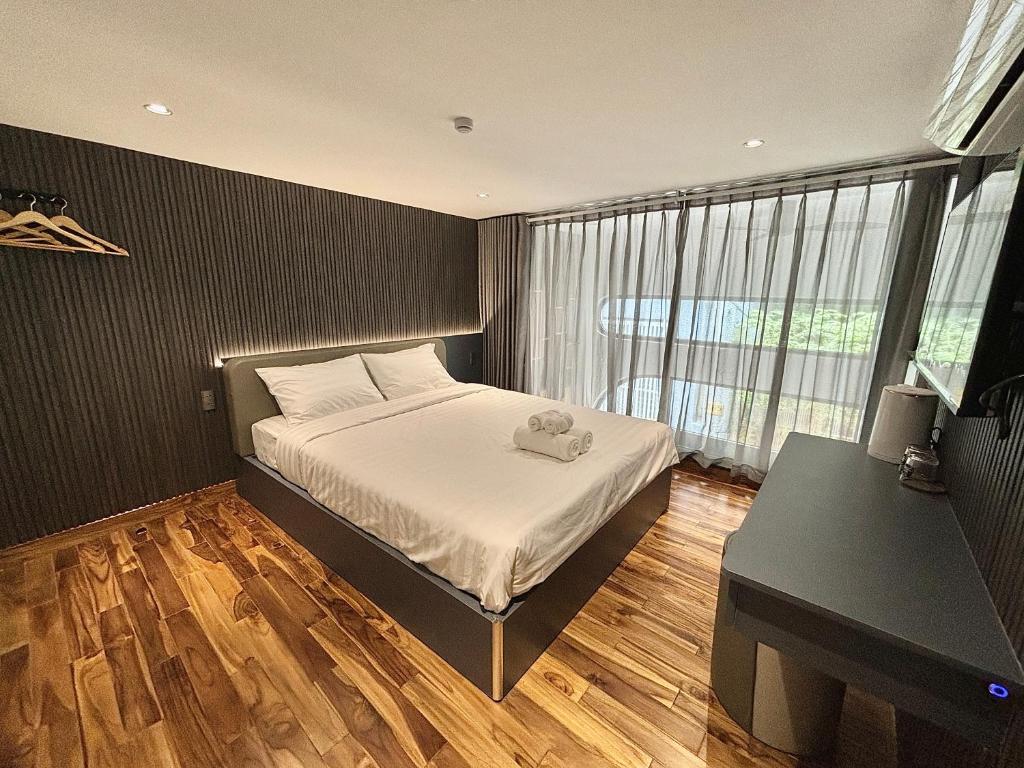 Postel nebo postele na pokoji v ubytování CEVA Hotel & Apartment Danang