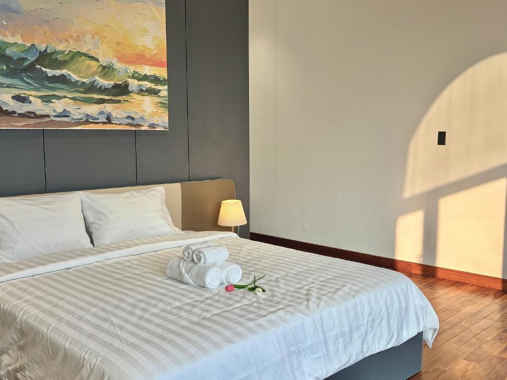 Postel nebo postele na pokoji v ubytování CEVA Hotel & Apartment Danang