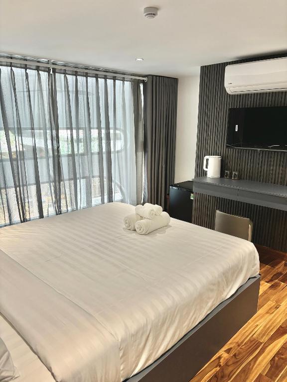 Postel nebo postele na pokoji v ubytování CEVA Hotel & Apartment Danang
