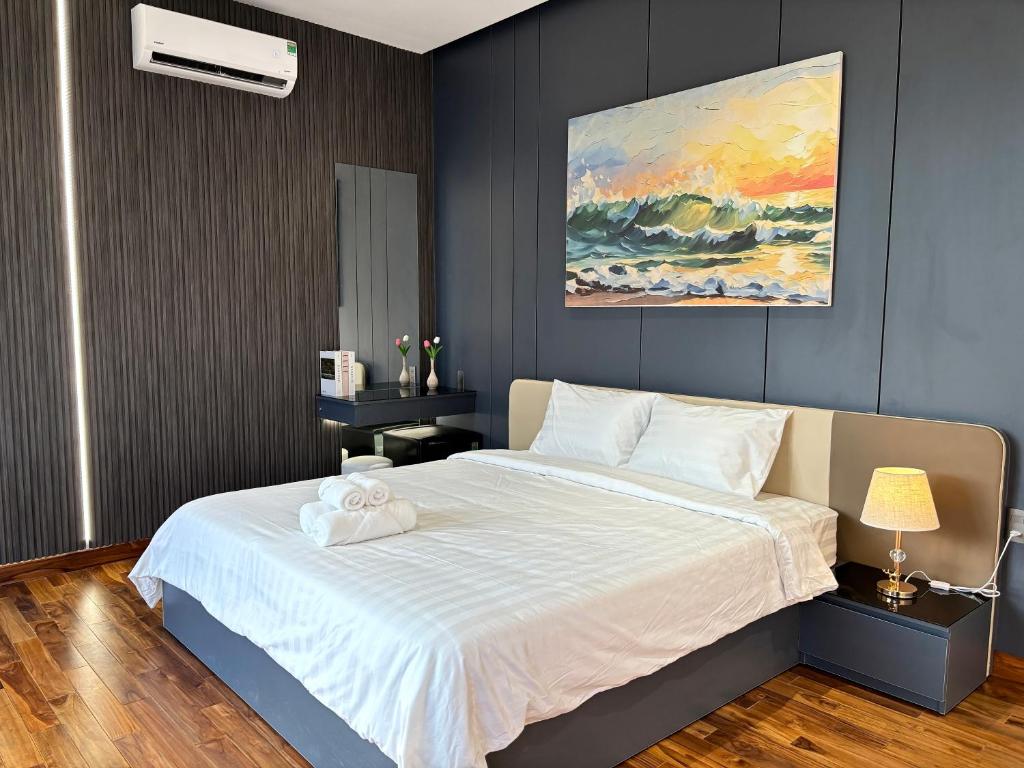 Postel nebo postele na pokoji v ubytování CEVA Hotel & Apartment Danang