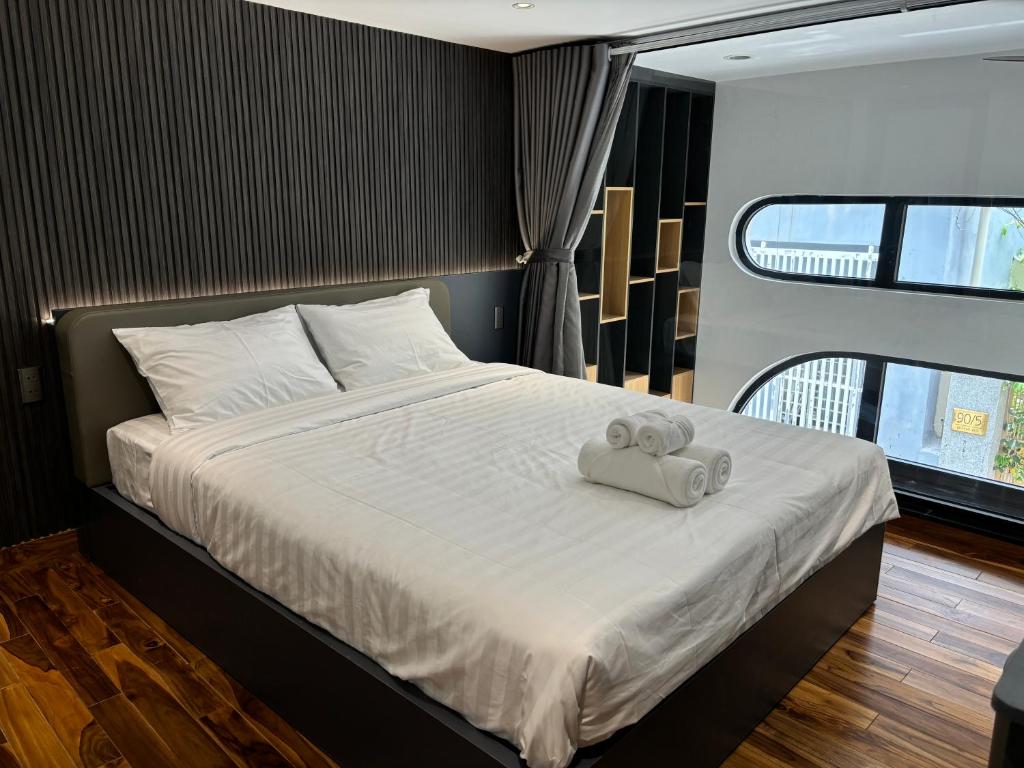 Postel nebo postele na pokoji v ubytování CEVA Hotel & Apartment Danang