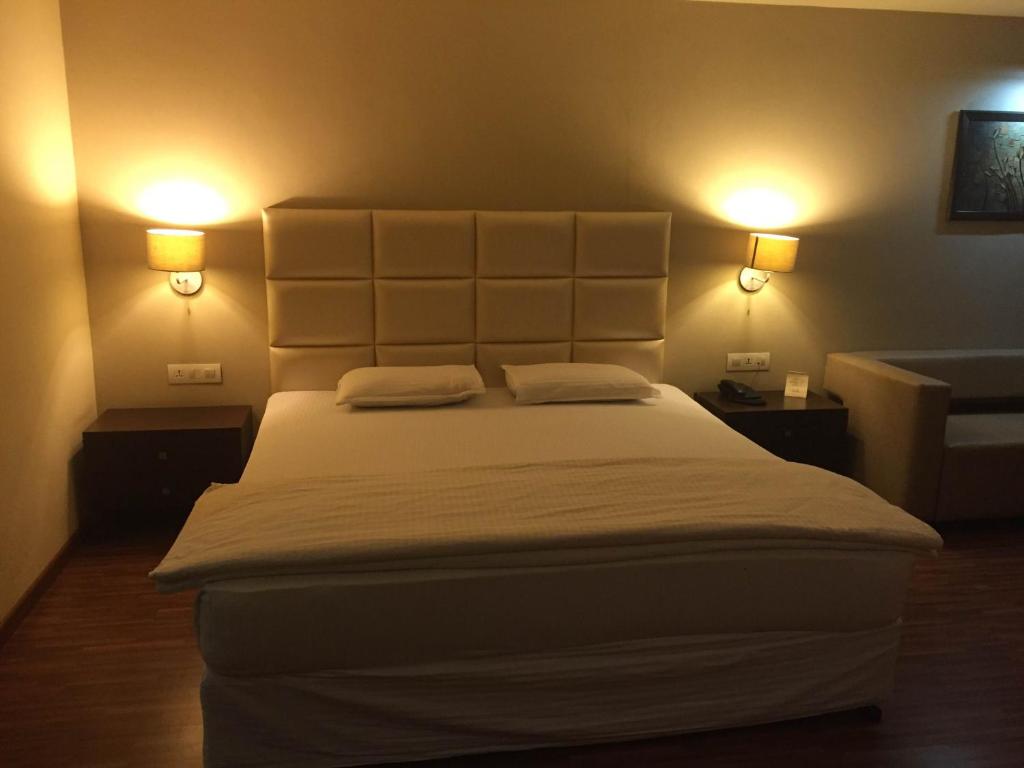 Postel nebo postele na pokoji v ubytování Hotel Platinum Inn