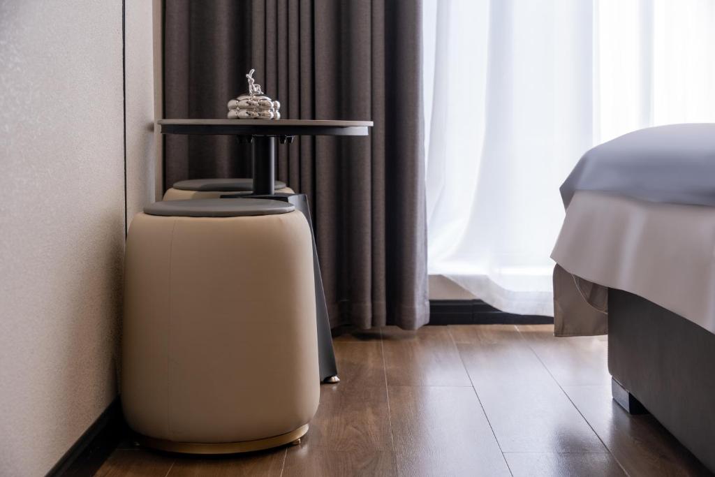 Postel nebo postele na pokoji v ubytování Shanming Boutique Homestay