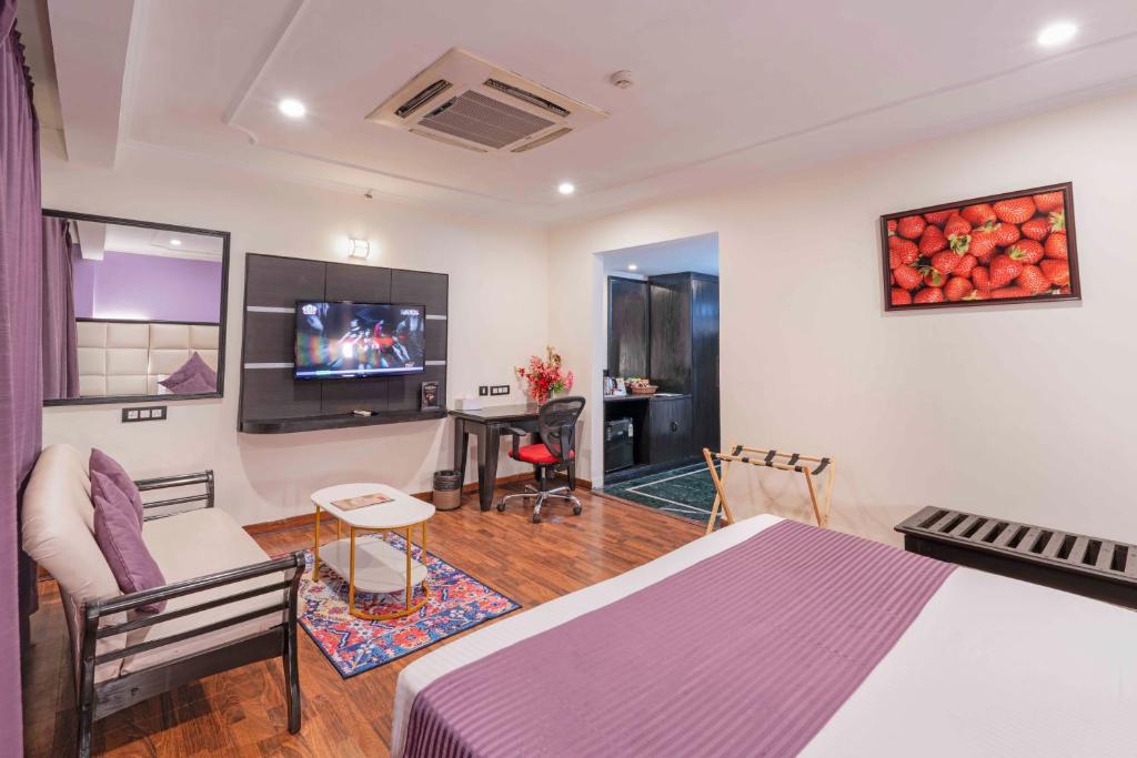 TV a/nebo společenská místnost v ubytování Indismart Hotel