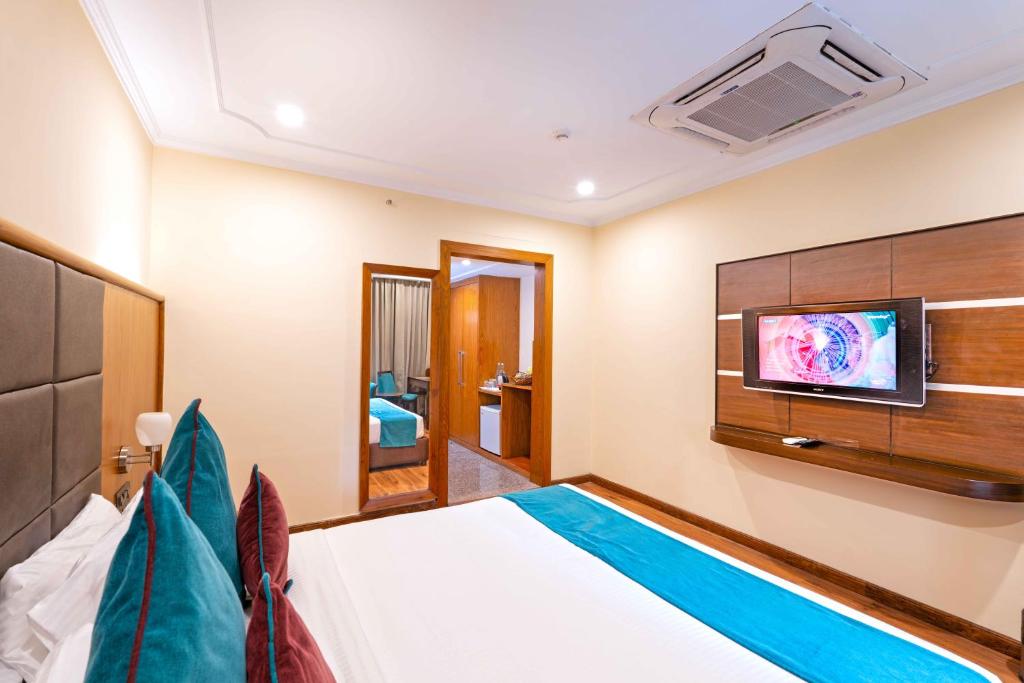 TV a/nebo společenská místnost v ubytování Indismart Hotel