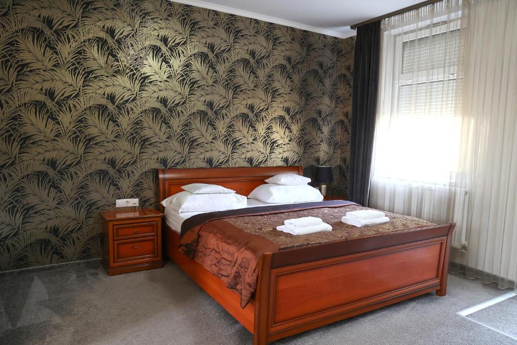 Postel nebo postele na pokoji v ubytování Hotel Forras