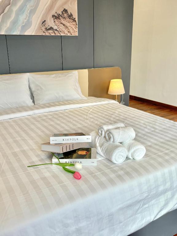 Postel nebo postele na pokoji v ubytování CEVA Hotel & Apartment Danang