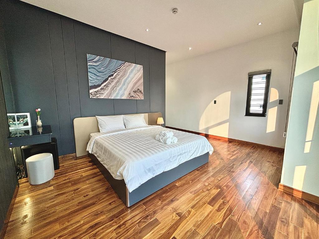 Postel nebo postele na pokoji v ubytování CEVA Hotel & Apartment Danang