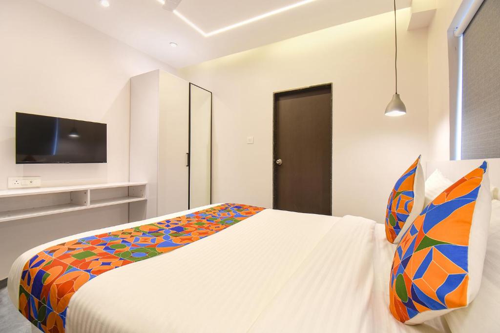 Postel nebo postele na pokoji v ubytování FabHotel Olive Suite - Near Airforce get