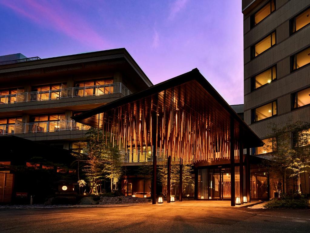 a building with a bunch of lights on it at Ooedo Onsen Monogatari Premium Hotel Fugetsu in Beppu