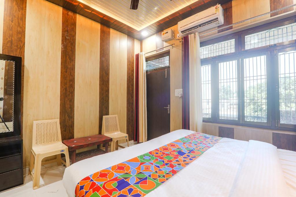 Postel nebo postele na pokoji v ubytování FabHotel Uma Yugul