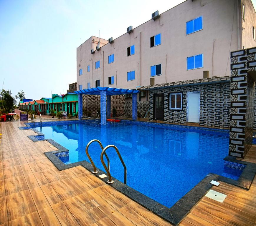 Bazén v ubytování Samriddha Beach Resort nebo v jeho okolí