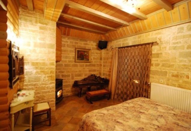 Postel nebo postele na pokoji v ubytování Lithos