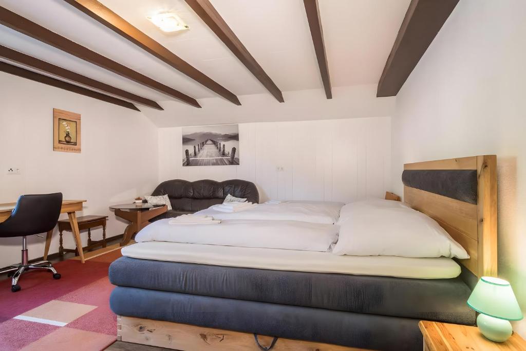 Katil atau katil-katil dalam bilik di Ferienhaus Villa Kanisblick
