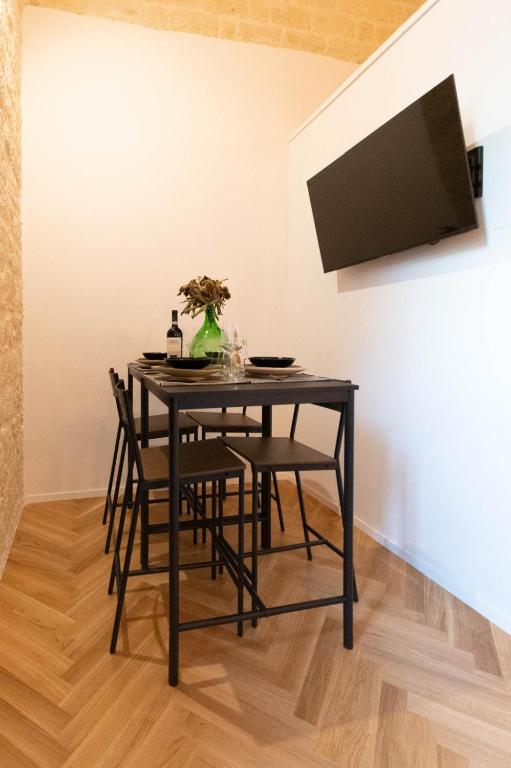 TV a/nebo společenská místnost v ubytování Centro Storico Rooms & Suites