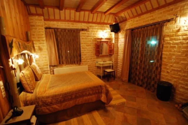 Postel nebo postele na pokoji v ubytování Lithos