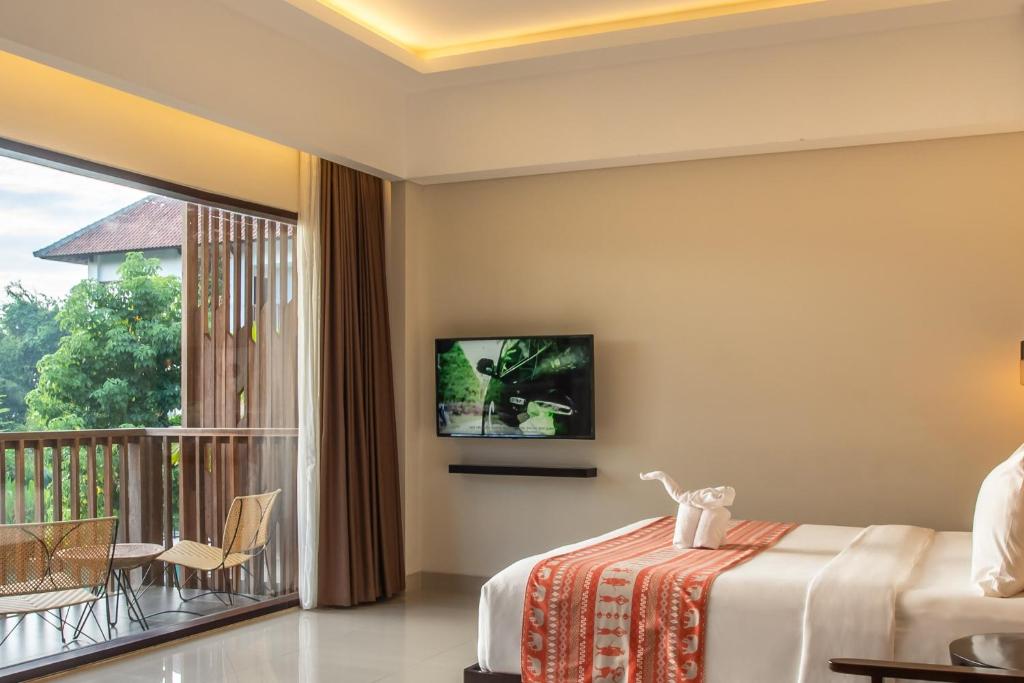 TV a/nebo společenská místnost v ubytování Sanctoo Suites & Villas