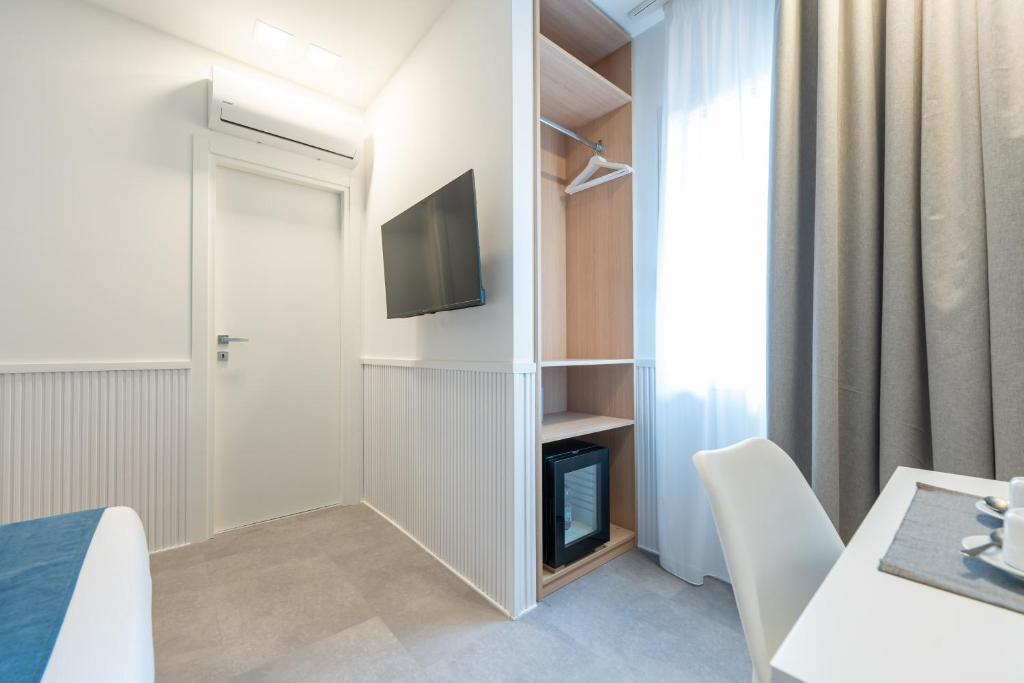 TV a/nebo společenská místnost v ubytování Toledo Mill Relais - By Pera Rooms Collection