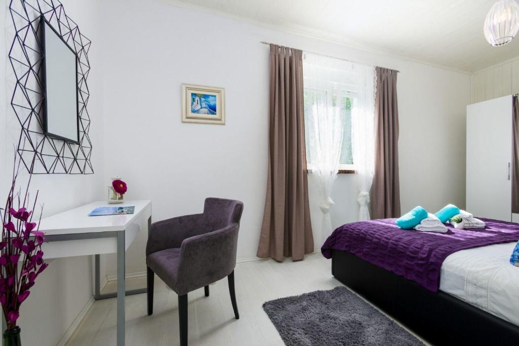 Postel nebo postele na pokoji v ubytování Apartment Jurica