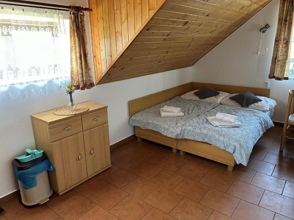 Postel nebo postele na pokoji v ubytování Slunečná Lada