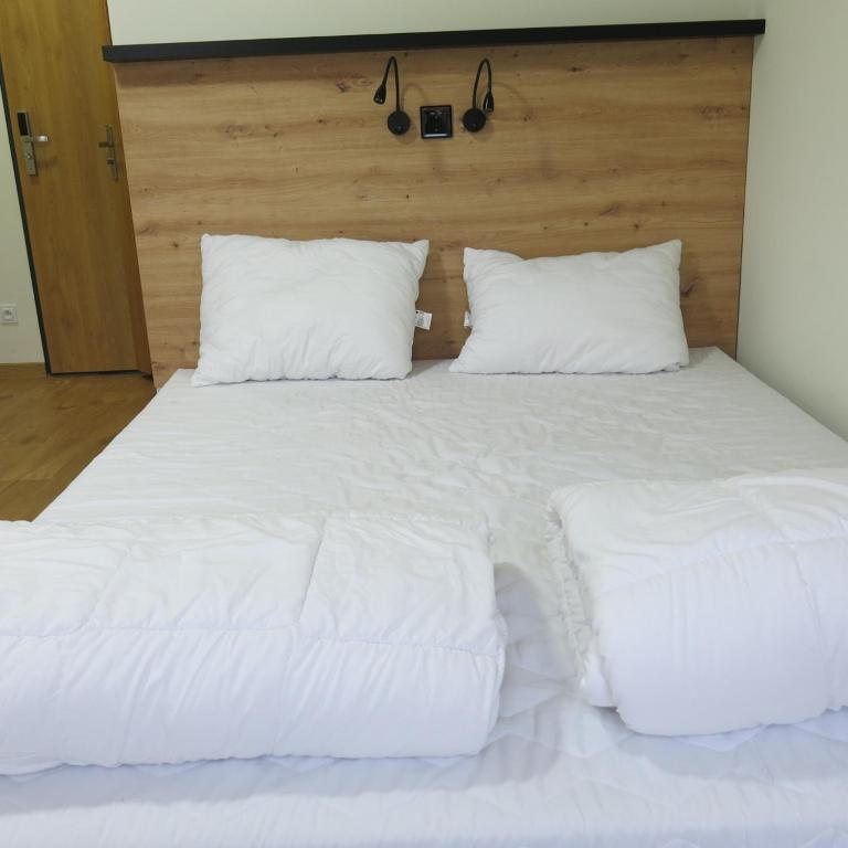 Postel nebo postele na pokoji v ubytování FOKA Hostel