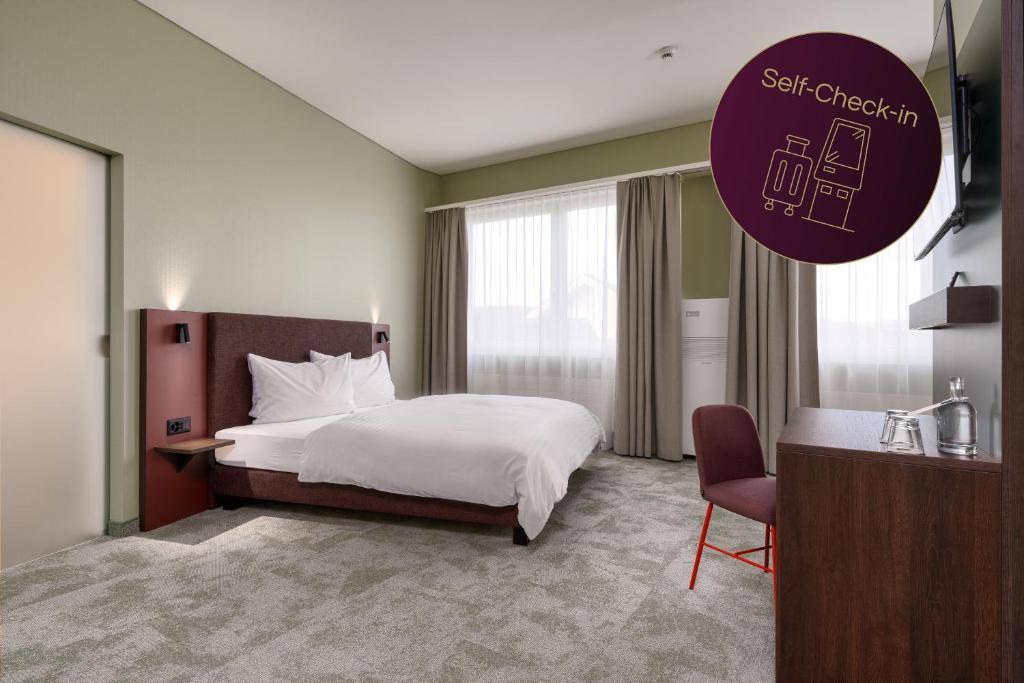Postel nebo postele na pokoji v ubytování b-smart hotel Schönenwerd
